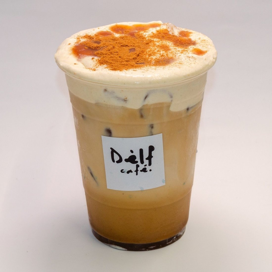 Iced salted caramel latte with cinnamon-dusted cream cap at Dèlf Café